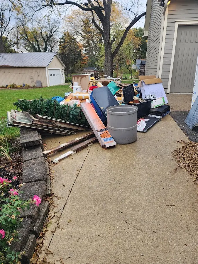 Dumpster being loaded with debris for Demolition Dumpster Rental in Elizabeth City